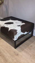 Load and play video in Gallery viewer, Black / Brown &amp; White Speckled Cowhide Ottoman / Footstool
